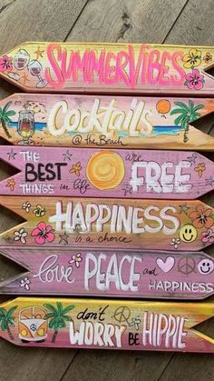 four wooden signs with different sayings on them