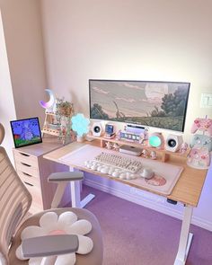 a computer desk topped with a monitor and keyboard