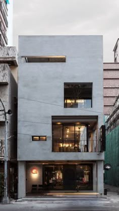 the building is made out of concrete and has two stories that are connected to each other