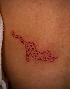 a tattoo on the back of a woman's shoulder