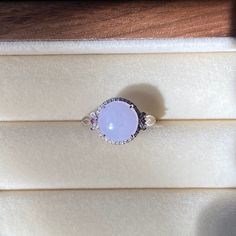 Ice Lavender Jade Ring, pinkish purple Jade Ring, 18K White Gold Jade Ring, Natural Grade A Burmese Jadeite Jade (18K金冰紫蛋面戒指)  ‼️Please contact us for the ring size‼️‼️ Color: Ice Lavender/Purple Jade Dimensions: 9.3×4mm Ring Size: 6.5（US) Material: 18k Rose Gold With Diamond  Genuine type A jade, 100% natural, No chemical bleaches and/or acids and impregnating. No artificially stained or dyed. Jade is a natural product that always has imperfections. These are considered to be part of the beauty and uniqueness of the jade stone. On different backgrounds, jade will show a bit different color, please take a look at the following detailed pictures, we promise these pictures are all photoed under sunlight indoor near a window without any edit. Purple Jade Ring, Pink Opal Ring With Accent Stones As Gift, Pink Opal Gemstone Ring For Anniversary, Pink Sapphire Ring With Gemstone Accents, Purple Opal Ring Gift, Exquisite Pink Sapphire Round Rings, Elegant Pink Opal Moonstone Ring, Pink Round Cabochon Ruby Ring, Pink Cabochon Ruby Ring