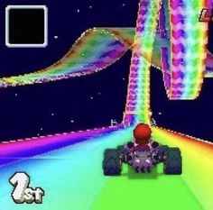 an old computer game with a car driving on the road and rainbow colored lines coming out of it