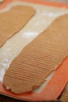 a close up of some food on a plate with paper towel and orange tape around it