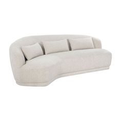 a white couch with four pillows on the back and one arm folded up to show it's curved shape