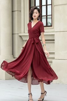 Make a statement in this stunning burgundy chiffon wrap dress. The V-neckline and short sleeves create a flattering silhouette, while the wrap design allows you to adjust the fit to your liking.  DETAILS * Made of chiffon * Chiffon Lining * V-neck collar * No buttons, belted dress * A Line dress, Wrap dress * Above the ankle * Perfect for Summer, Spring * Wash by hand or machine with cold water, Ironing after dry * The model is 168cm (5′ 6″) tall with a 80cm (31.5") bust, 66cm (26") waist. She is wearing a XS. Choose CUSTOM Order if you * Need a better fit * Can't find your size in our size Chart * Change the Style * Chang the Length * Your Height is not Between 5'1" - 5"9" * Your weight is over 75kg SIZE GUIDE Size vary between Brand and Country Please get your body measurement with our S Elegant Modest Dresses, Wrap Dress Summer, Long Chiffon Dress, Chiffon Wrap Dress, Chiffon Dress Short, Short Sleeves Dress, Chiffon Wrap, Custom Dress, Chiffon Dress Long