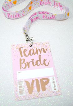 a badge with the words team bride on it and a lanyard attached to it