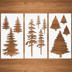 four different types of pine trees cut out on white paper with wood grained background