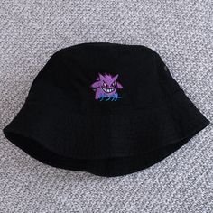 ゲンガー means Gengar in Japanese. A great gift or piece for everyday wear. Direct embroidery, only available here at Embroidered Dad Hats! * Embroidered on a cotton bucket hat. * Small-Medium is 22" and Large-XL is 23.5" circumference. * Embroidered in Dallas, Texas. * Free poly-bag shipping in US (more options at checkout). More styles: Dad Hat https://www.etsy.com/listing/988087326 Beanie https://www.etsy.com/listing/1320519670 If you like this, check out our small shop: https://www.etsy.com/shop Embroidered Bucket Hat, Cotton Bucket Hat, Bucket Hat White, Bucket Hat Black, 90s Anime, Poly Bags, Hats For Sale, Bucket Hats, Dad Hat