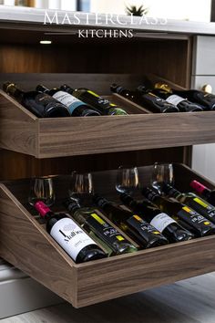 two wooden drawers holding wine bottles and glasses