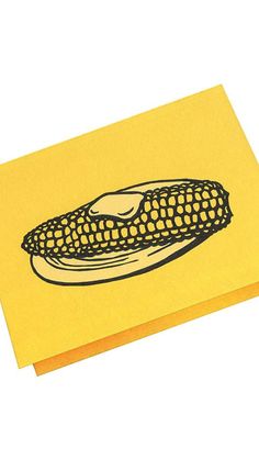 a corn on the cob drawn on yellow paper