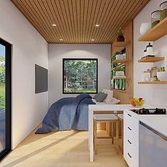 an artist's rendering of a kitchen and bedroom in a tiny cabin style home