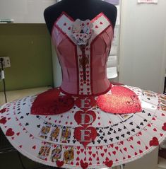 a dress made out of playing cards is on display