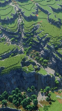 an aerial view of trees and rocks in the middle of a green area with blue sky