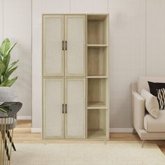 a living room with a couch, chair and bookcase