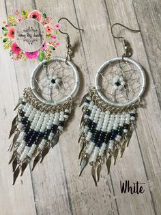 Visit my Store for more beautiful Jewelry ----- https://www.etsy.com/shop/HoneyRossJewelry This beautiful set of dreamcatcher is made with much love in Peru, has several processes of preparation, from the making of the ring made of wire and thread, then the fabric inside the ring with silver thread with small crystals, and finally the preparation of the beads made with alpaca wire and beads. ------Product characteristics----- ☼The ring of the earring and necklace is the size of a 1 dollar coin. ☼The approximate measurement is 3 inches ☼Length of the necklace: 9 inches I'm sure that you will love these beautiful earrings and necklace. Both will reach your hands in a nice bag of organza and carefully packaged. ♥ A dream catcher is an article made by hand, whose base is a ring made of alpaca White Wire Wrapped Dangle Beaded Earrings, Handmade Dream Catcher, Dreamcatcher Earrings, Mothers Day Gift Ideas, Small Crystals, Dream Catcher Earrings, Handmade Dreamcatcher, 1 Dollar, Thread Earrings