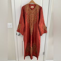 Nwot True To Color! Has Orange, Beige, And Bronze Embroidered Design Throughout The Dress And Sleeve Area! This Is Made In Saudi Arabia And Is A True To Size Xl. Dimensions Listed Below. It Is Very Cute For Ramadan Outings As Well! I Have A Small Middle Eastern Traditional Clothes And Souvenirs Business. If You May Be Interested Search Middle East” In My Closet To Locate Them! Dimensions: 24.5 Inches Armpit To Armpit 22.5 Inches Sleeve Length 9 Inches Sleeve Width 53 Inches Overall Length Embroidered Silk Maxi Length Kaftan, Bollywood Style Long Sleeve Silk Kaftan, Festive Floral Embroidered Abaya For Eid, Eid Festive Abaya With Floral Embroidery, Red Embroidered Silk Kaftan, Festive Embroidered V-neck Thobe, Festive Long Sleeve Kaftan With Dabka Work, Silk Kaftan With Floral Embroidery And Long Sleeves, Silk Long Sleeve Kaftan For Eid