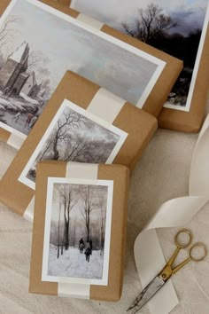 some pictures and scissors on a table with white paper in front of them that says diy project winter scene painting gift toppers