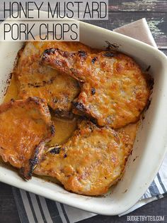 honey mustard pork chops in a white casserole dish with text overlay