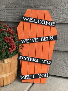 a wooden sign that says, welcome we've been dying to meet you