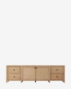 the sideboard is made out of wood and has three drawers, one with two open doors