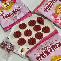 three bags of jelly candies sitting on top of a white table next to each other