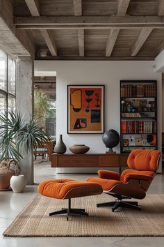 an orange chair and ottoman in a modern living room with large windows, potted plants and bookshelves