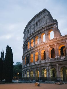 the roman colossion is lit up at night