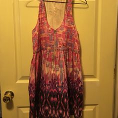 Super Cute Summer Dress With Pink And Purple Patterns All Over. The Dress Has A Draw String On The Back To Tighten For The Perfect Fit! Never Worn-Only Tried On. Purple Mini Sundress, Summer Sleeveless Purple Mini Dress, Purple Sleeveless Sundress, Purple Sleeveless Dress For Day Out, Casual Purple Sleeveless Sundress, Casual Purple V-neck Sundress, Purple Mini Dress For The Beach, Bohemian Purple Sleeveless Mini Dress, Casual Purple Sleeveless Mini Dress