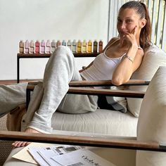 a woman sitting on top of a white couch