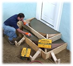 a man is sanding up some furniture