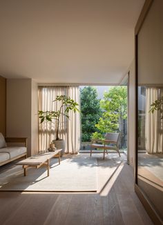 a living room filled with furniture and windows