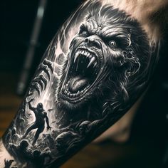 a man's arm with a black and white tattoo of a gorilla on it