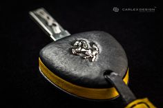 a black and yellow case with a silver lion on it