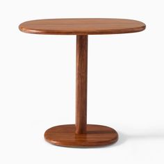 a wooden table with a round base on the top and one leg in the middle