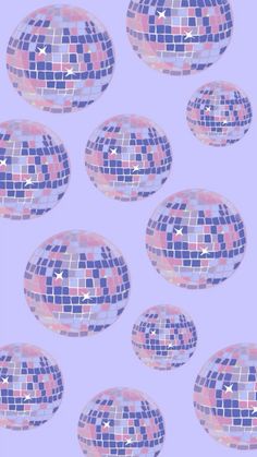 a bunch of disco balls on a purple background