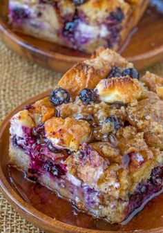 blueberry cream cheese french toast bake is shown on a plate with the title above it