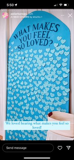 a blue sign that says what makes you feel so loved? with hearts on it