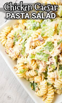 chicken caesar pasta salad in a white bowl on a wooden table with text overlay