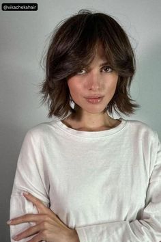 Choppy layers and curtain bangs come together to create a playful style that flatters lots of face shapes—you can make it fit yours by adjusting the parting, the thickness or the length of the bangs Shag Bob Haircut, Layered Bob With Bangs, Long Layered Bob, Bob Cuts, Layered Bob, Short Hair With Bangs, Short Hair With Layers