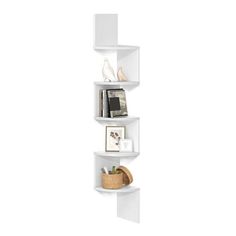 three white shelves with pictures and other items on top of them, one is leaning against the wall