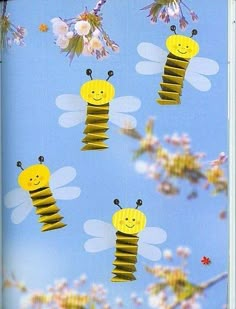 the bees are flying through the sky with flowers on it's back and behind them is a blue background