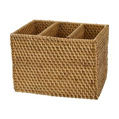 a brown basket with three compartments on it