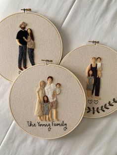 three embroidery hoop paintings depicting family members and the words, the young family on them