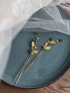 Emerald hair pins Gold and emerald hair pins Bridal emerald hair accessories Green hair piece Emerald hair piece -------------------- Materials:    - Jewelry wire gold plated  - rhinestones  - Gold leaves -------------------- length - 7 cm (2.7 in) The wedding is an unforgettable moment in the life of every girl. We all want to be perfect on this day, for this we choose a fairy dress, shoes and an indelible attribute is jewelry. Each girl chooses what is most suitable for her. These elegant hair Moulin Rouge Hair Accessories Emerald, Emerald Hair Piece, Green Hair Piece, Emerald Green Hair, Hair Accessories Green, Emerald Hair, Dancing Outfit, Gold And Emerald, Hair Pins Bridal