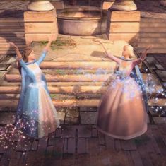 two women in dresses are dancing with sparkles on their hands and arms as they look at the sky