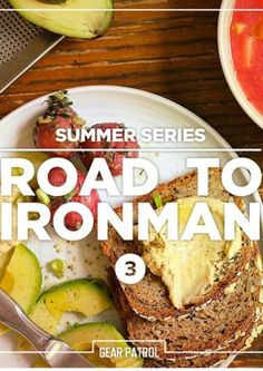 the road to ironman 3 poster is displayed on a plate with fruit and bread