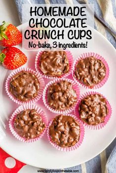 chocolate cupcakes on a plate with strawberries