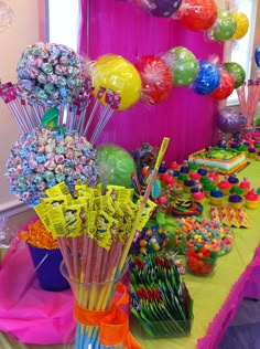 the table is covered with candy and candies