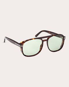 Made in Italy, these Tom Ford sunglasses detail their patterned navigator frames with an iconic double bridge, signature logo detailing and total light-blocking lenses. Frames: 100% acetate Lenses: 100% UV protection Wipe with soft cloth Made in Italy Measurements Lens width: 58mm Bridge width: 16mm Temple length: 140mm | Tom Ford Women's Shiny Classic Havana & Green Eco T-Logo Navigator Sunglasses Stylish Glasses For Men, 70s Sunglasses, Trendy Glasses, Sincerely Jules, Stylish Glasses, Tom Ford Sunglasses, Acetate Sunglasses, Mens Glasses, Signature Logo