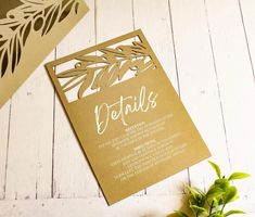 the wedding stationery is made out of gold paper